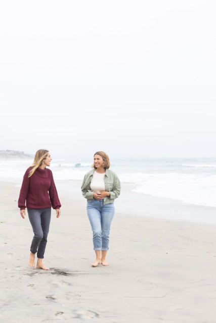 Two women walking together — support and connection